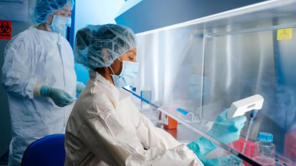 lab workers doing research in the Translational Cell Therapy Lab