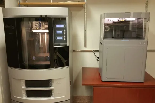 The Stratsys 3F printer dimension Elite is shown on the left; the Markforged X7 3D printer on the right.