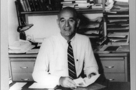 black and white photo of Professor James Douglas McCullough at his desk