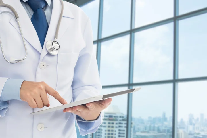 Doctor holding tablet