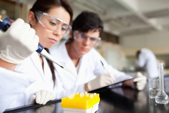 Lab workers with samples