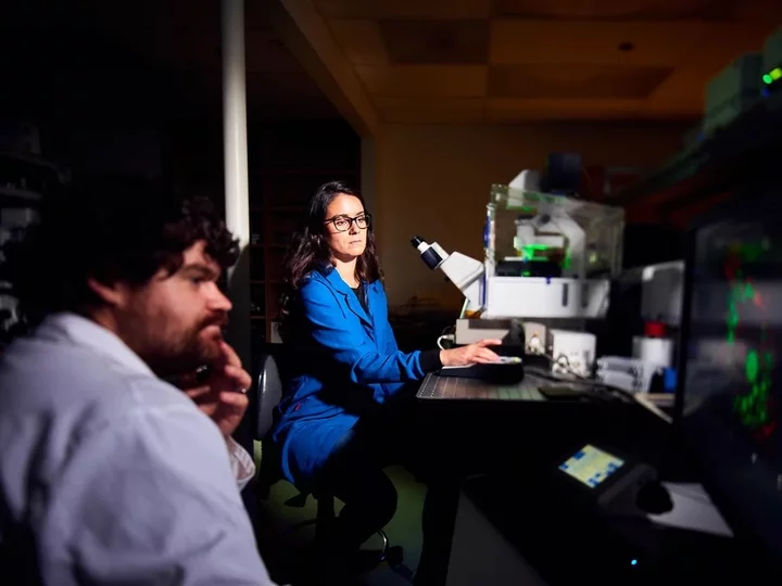 Woman and man conducting research in lab