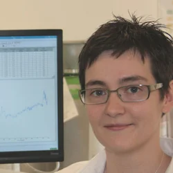 Carrie Ferguson sitting next to computer